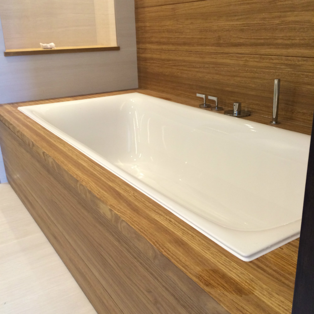 sunken bathtub with white silicone