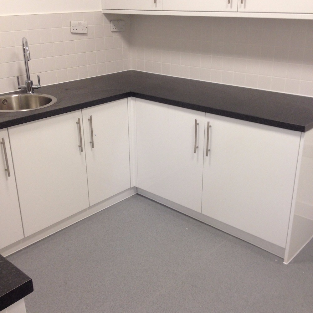 new kitchen install finished in white silicone around worktop and sink area
