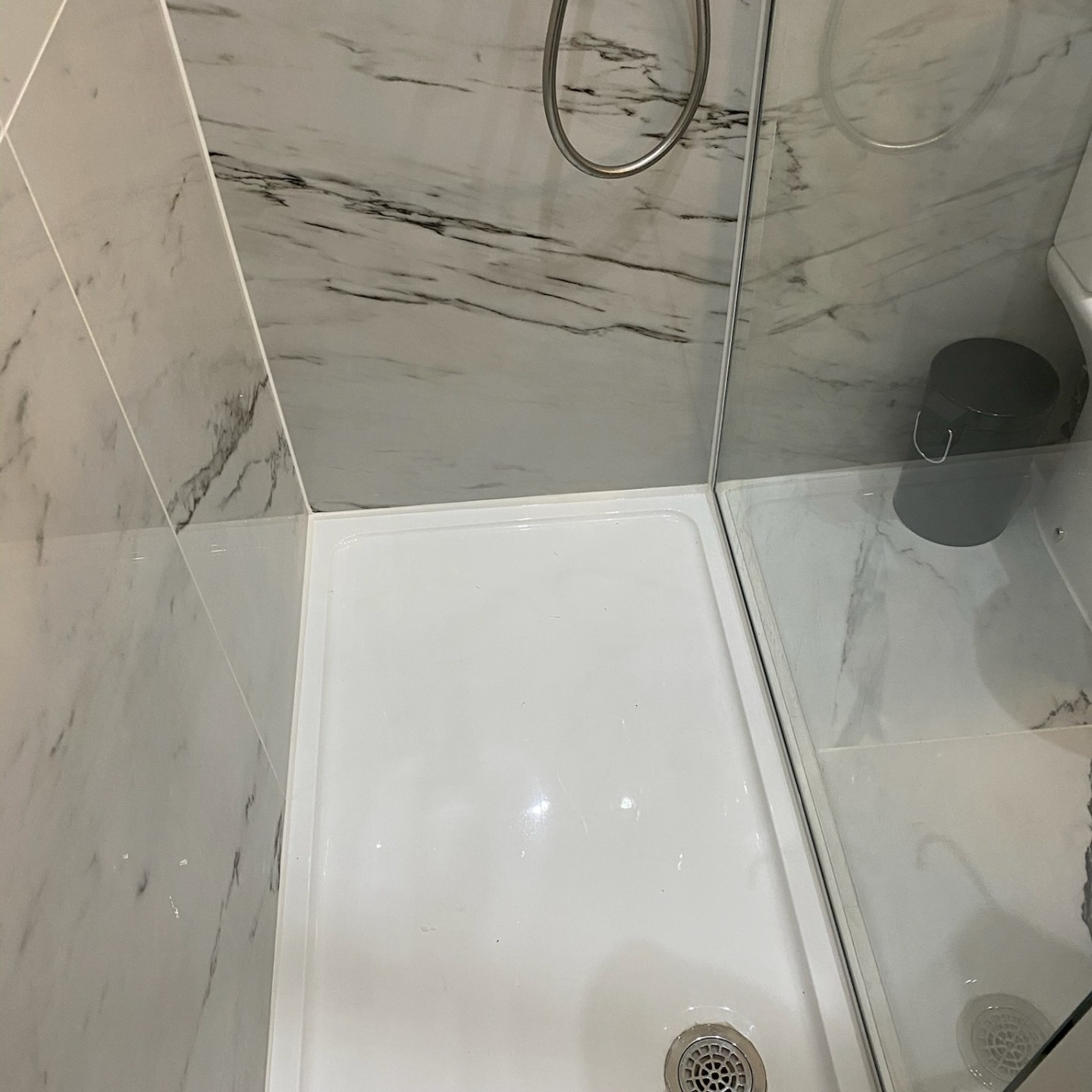 white mastic in shower tray and vertical joints