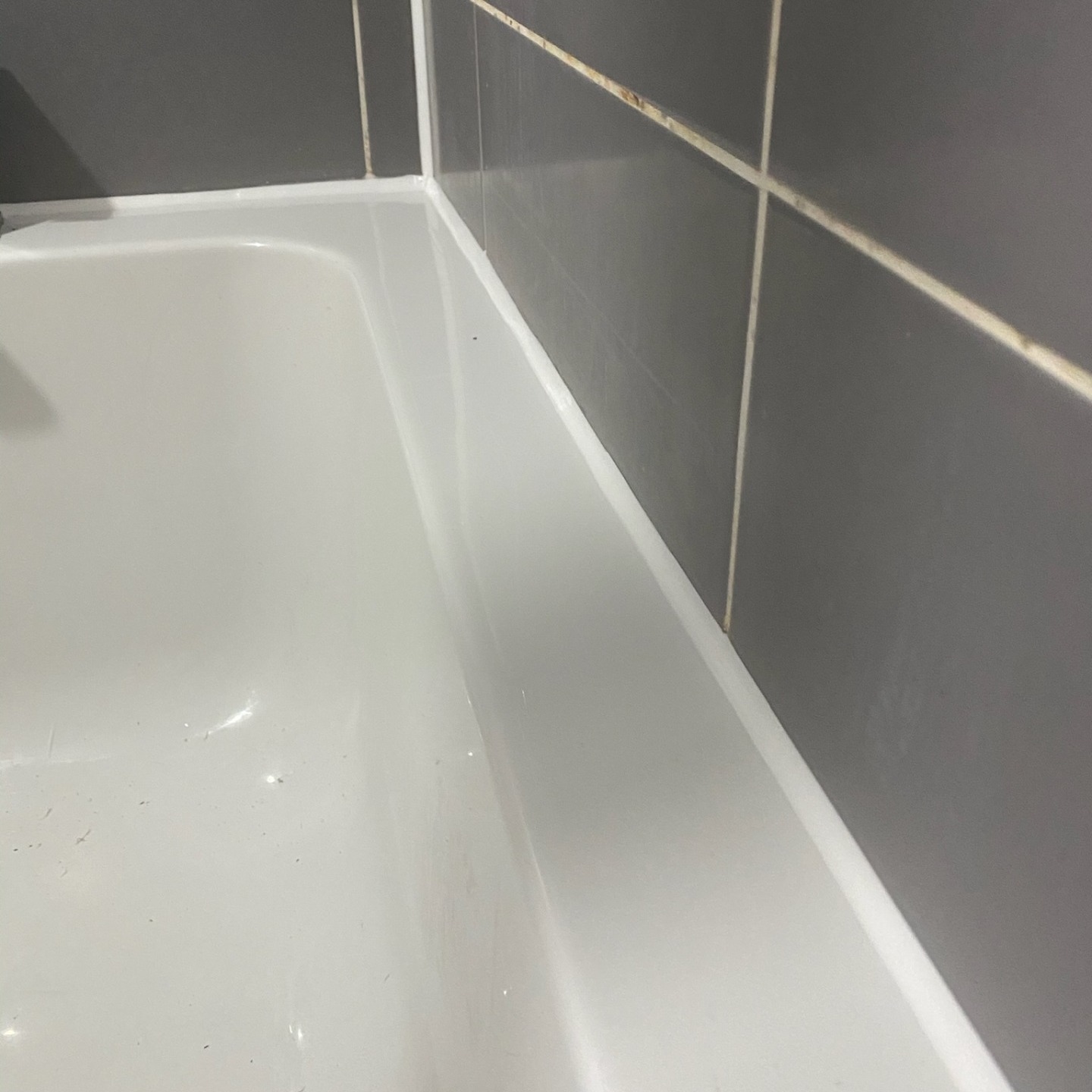 fresh mastic applied to bathtub