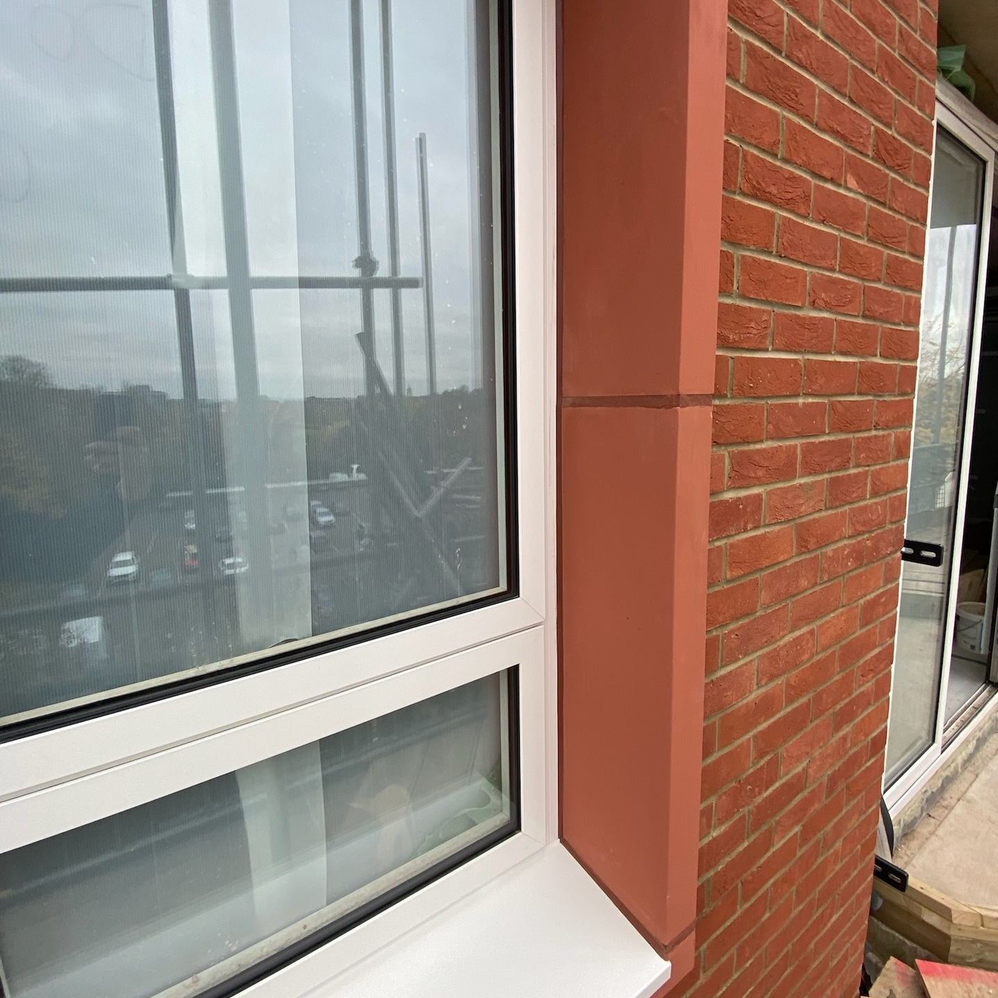Brick coloured silicone around window frame to wall join