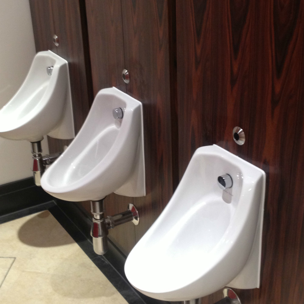 white silicone around public urinals